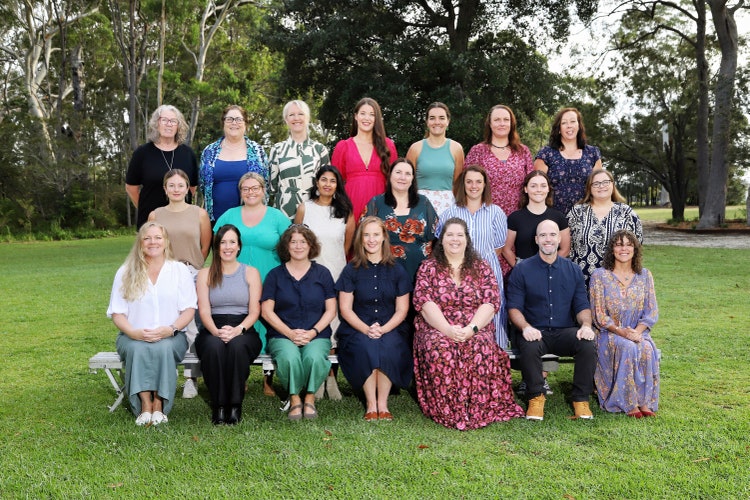 staff photos on back lawn area of school